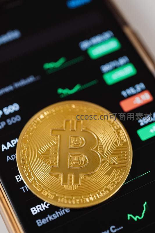 比特币模型置于显示股票行情的手机上
