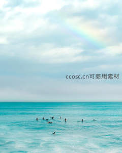 冲浪者在彩虹下的碧海中等待波浪