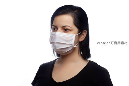 黑发女子佩戴白色口罩侧脸特写