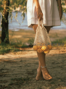 赤足提网袋柠檬的田园时光