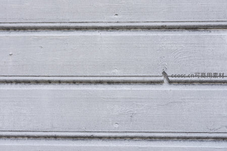 白色木板缝隙中的小钉子