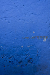 剥落的蓝色墙面纹理特写