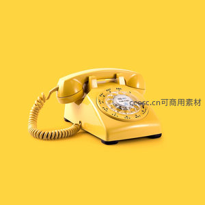 复古黄色拨盘电话机静置纯色背景