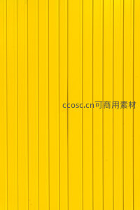 垂直条纹构成的明亮黄色背景墙