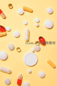 多彩药片散落于明黄背景之上