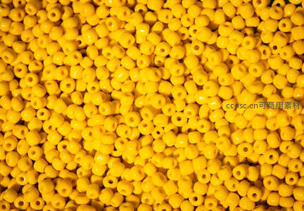 密集亮黄色串珠纹理背景
