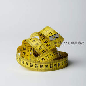 盘绕的黄色卷尺测量工具