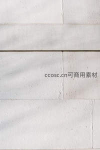 白色石材墙面光影斑驳纹理特写