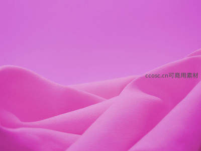 柔滑粉色布料褶皱，细腻质感特写