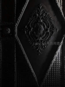 黑色浮雕装饰面板的华丽纹理特写