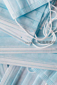 蓝色医用口罩堆叠特写