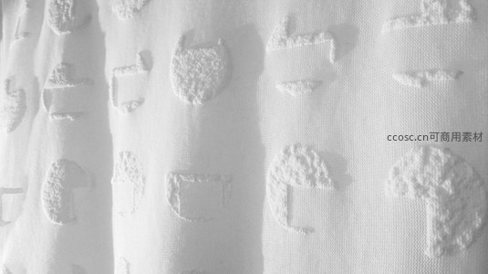 白色织物表面凸起几何图案的细腻微距特写