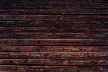 深色木质纹理背景，自然木纹与节疤细节