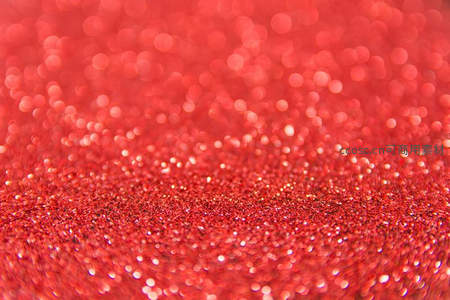 红色闪光粉的梦幻散景背景