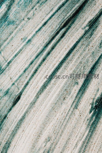 沙粒与深蓝条纹的肌理特写