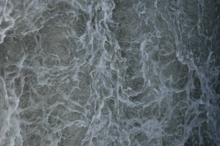 深色海浪泡沫交织的抽象纹理