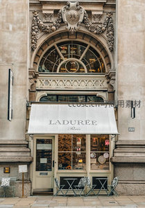 巴黎Ladurée甜品店古典门面，石雕繁复，遮阳篷洁白优雅