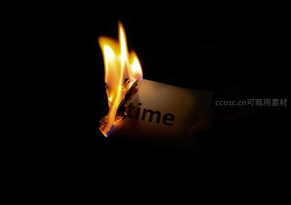 写有'time'字样的纸张在黑暗中被火焰吞噬，象征时间流逝